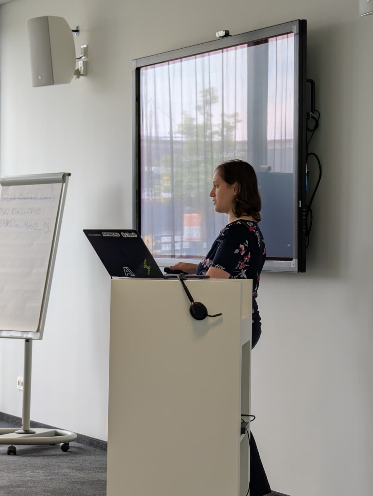 Dina Levitan leading an AI training session with a laptop running Claude